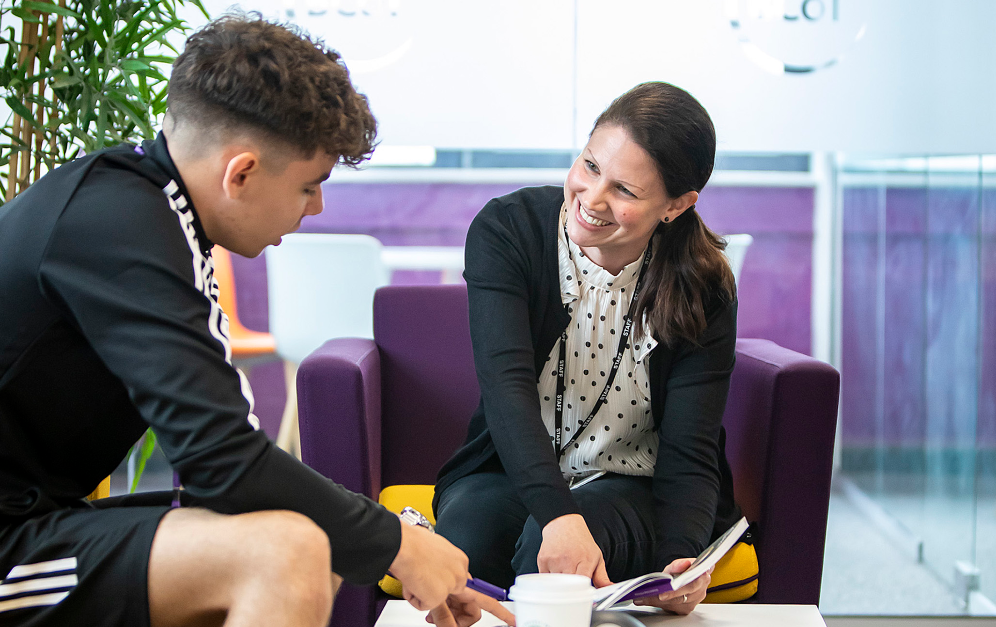 Teacher Smiling At Student